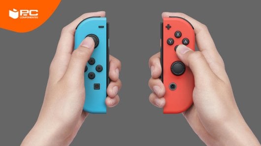 Unas manos mostrando como se cargan los mandos Joy-Con de Nintendo Switch