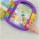 Libro musical interactivo Fisher-Price Laugh & Learn con 6 canciones y botones luminosos