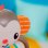 Sonoro Musical Bright Starts Grab & Giggle Monkey com Mais de 20 Sons e Luminoso