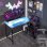 Scrivania angolare Aosom reversibile con LED, prese elettriche e USB, nera