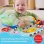 Cojín de juego Fisher Price Aventuras sensoriales con mordedor y sonajero