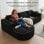 Divano angolare Boneless modulare letto 243cm velluto nero tasche laterali