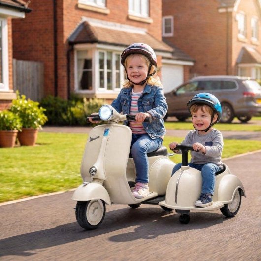 Moto eléctrica infantil Aiyaplay Vespa con asiento lateral y arranque suave